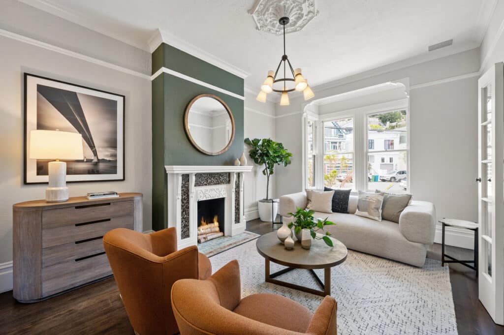 Living room with fireplace and period detail moldings in 1793 Sanchez St San Francisco