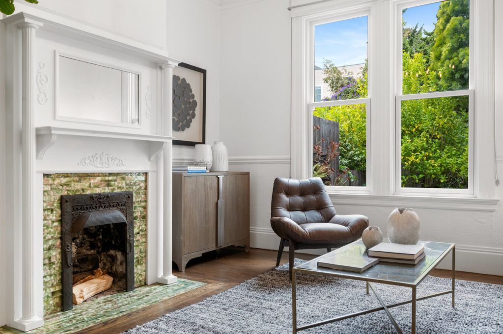 Den and fireplace of a San Francisco rental property listed by an out of town seller and Vivre Real Estate