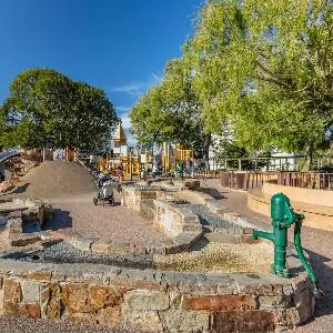 Scene from Lafayette Park with Stone Wall, Winding Sidewalks, and Hilly Views of San Francisco