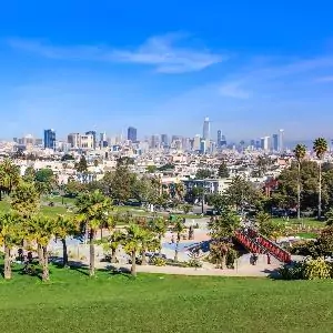 View of Dolores Park Green Grassy Knoll, Red Bridge and Skyline